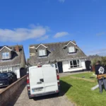 Roof repair team restoring storm-damaged roof in Dublin.