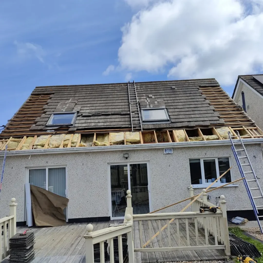 Close-up of damaged roof tiles being replaced for roof repair in Kildare