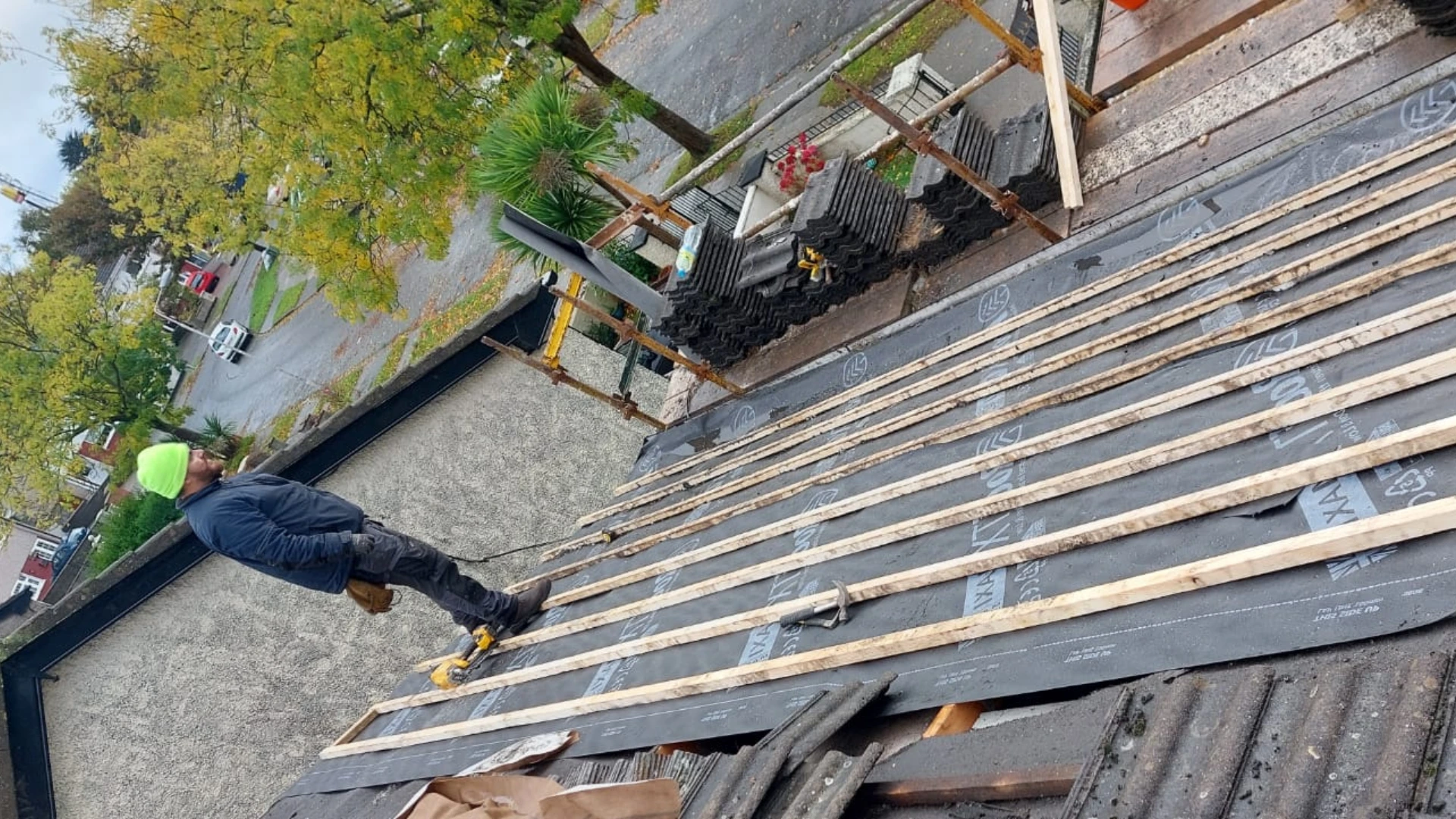 Experienced roofer performing roof installation using durable materials.