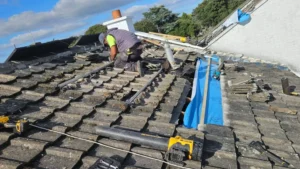 Team installing new roof shingles on Dublin area house as part of roof repair